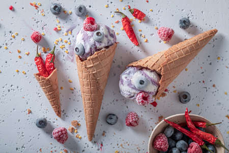 Fresh ice cream with chilli and fruits. Strange icecream. New flavors of ice cream.