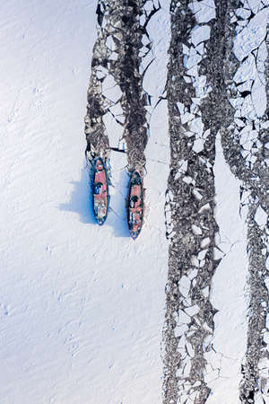 Aerial view of icebreakers on river crushing the ice. Winter in Polandの写真素材