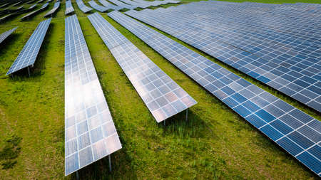 Aerial view of photovoltaic farm as a renewable energy source. Pure energy in the countryside.