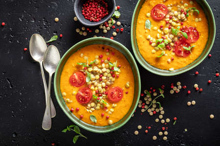 Delicious lentil soup made of legume vegetables and peppers. Yellow lentil soup made of vegetables.