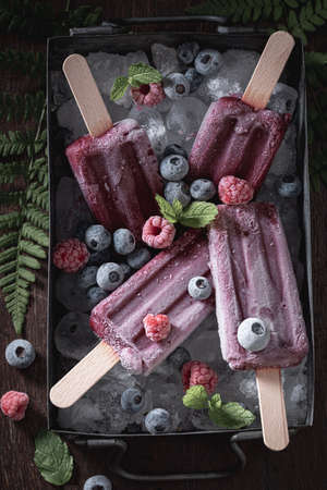 Purple ice cream sorbet made of blueberries and raspberries. Raspberries and blueberries sorbet ice cream.の写真素材