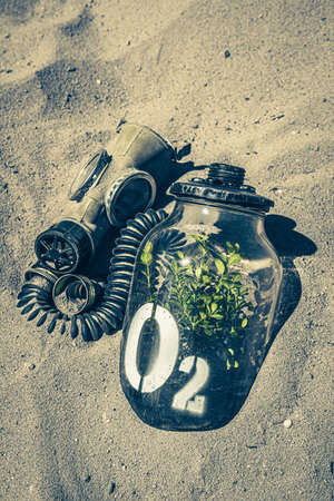 Weird oxygen mask as post apocalyptic vision of polluted earth. Climate change on earth and the lack of clean air.の写真素材