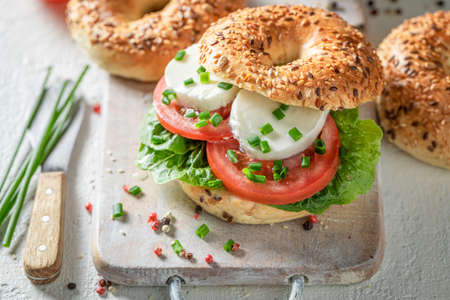 Homemade and spring golden bagels for quick and fresh lunch. Bagels with healthy spring ingredients.の写真素材
