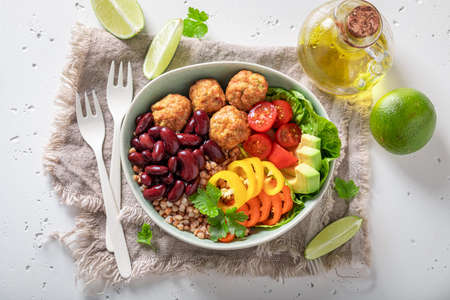 Wholesome Mexican salad with vegetables, meatballs and buckwheat groats. Healthy bowls on a diet.の写真素材
