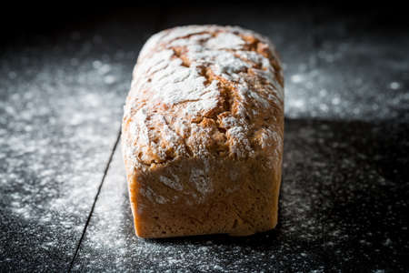 Closeup of bread with made of grains for breakfast on black table