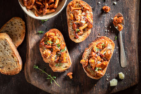 Vegetarian and crunchy toasts made of wild mushrooms, herbs and olive. Toasts made with cheese and whole grain bread.の写真素材