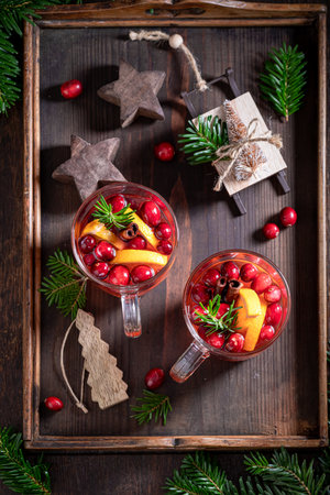 Hot Christmas punch made with cranberry and orange. Christmas winter drinks.の写真素材