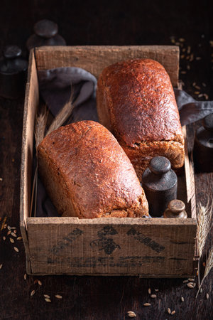 Healthy loaf of breads made with sourdough, water and flour. Rustic loaves of bread.の写真素材