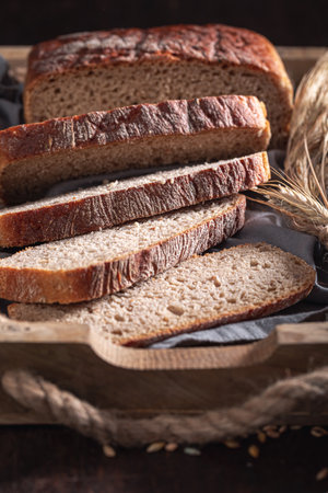 Fresh loaf of breads baked in a home bakery. Homemade bread in the countryside.