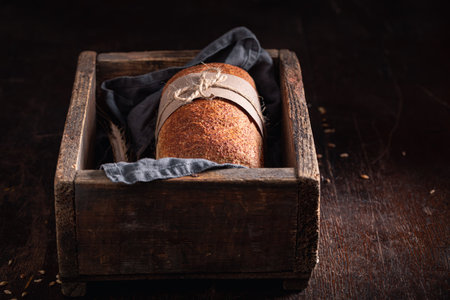 Healthy loaf of breads freshly baked in a bakery. Homemade bread in the countryside.の写真素材