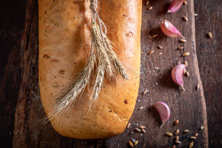 Fresh and crispy bread with garlic and herbs. Loaf of bread with garlic oil.