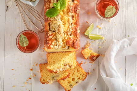 Sweet gooseberry yeast cake with crumble and glaze. Gooseberry yeast cake served with lemonade.
