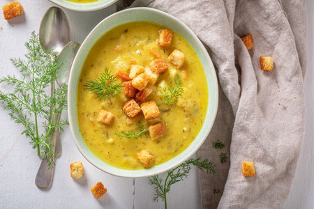 Homemade gherkins soup with dill and croutons. Minestrone soup with mix of vegetables.の写真素材