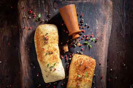 Homemade pepper buns freshly baked on wooden board. Rolls made from grains and pepper.の写真素材