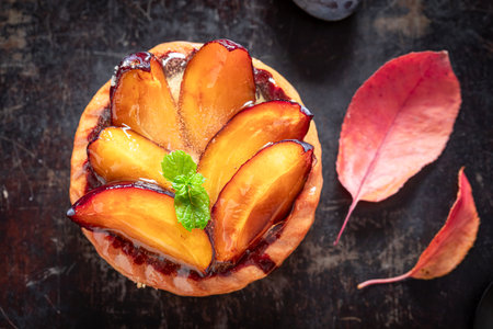 Tasty mini tart made of plums and local ingredients. Autumn cake with plums.の写真素材