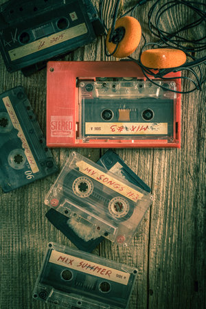 Vintage and old audio cassette with portable player and headphonesの写真素材