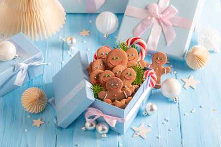 Tasty Christmas gingerbread mans as snack in Christmas gift. Cozy wintertime scene.の写真素材