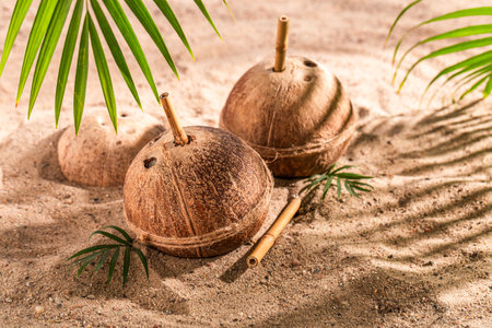 Healthy and fresh coconut milk in shell served on beach. Holidays on a paradise beach.の写真素材