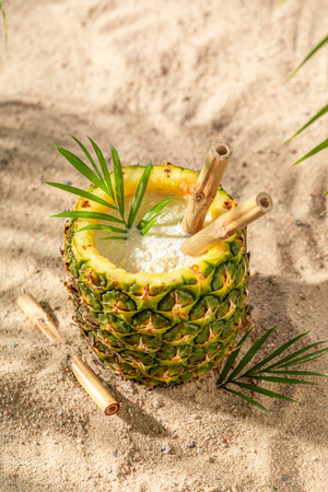 Fresh and delicious pinacolada in pineapple for hot days. Drink served on an exotic beach.の写真素材