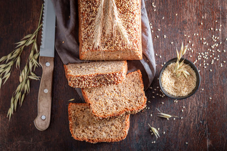 Tin wholemeal bread baked in home bakery. Homemade graham bread.の写真素材