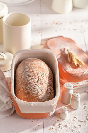 Healthy and hot loaf of bread in home bakery. Homemade bread.の写真素材