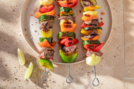 Spicy grilled skewer made of beef and vegetables. Roasted shashlik seasoning with spices.の写真素材
