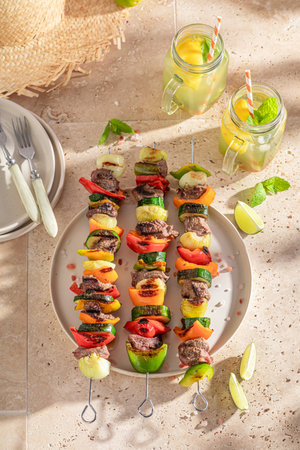 Spicy grilled skewer with vegetables and beef. Roasted shashlik seasoning with spices.の写真素材