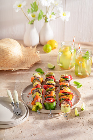 Fresh roasted skewer as summer snack for bbq. Shashlik with grilled meat and vegetables.の写真素材