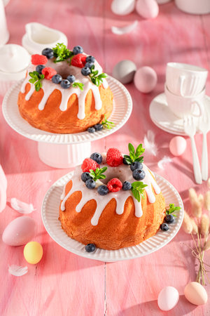 Tasty ring cake for Easter accompanied by eggs and willows. Traditional polish easter dessert.の写真素材