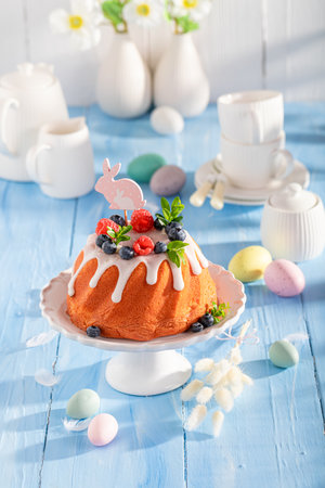 Glazed ring cake for Easter baked in home oven. Bundt cake as Babka for Easter.の写真素材