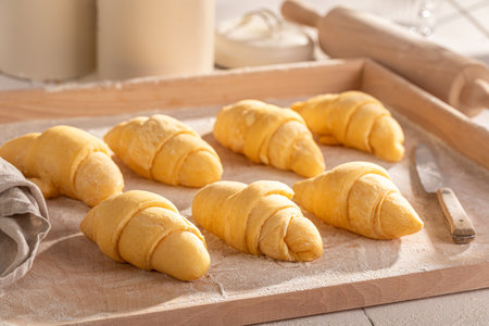 Delicious french croissants made of fresh ingredients Raw croissants before baking.の写真素材