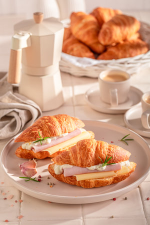Homemade and hot french croissant with ham and cheese. Croissants as fresh sandwich with cheese.の写真素材
