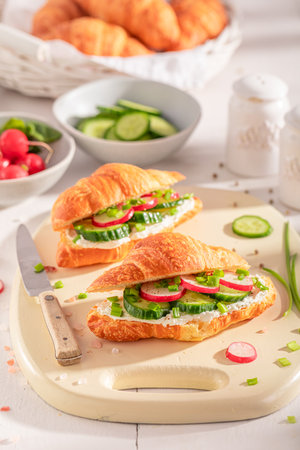 Healthy and homemade french croissant for vegetarian breakfast. Croissants as fresh sandwich with vegetables.の写真素材
