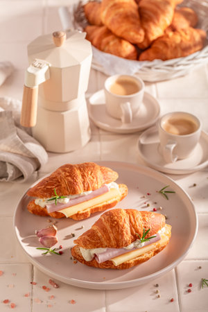Golden and fresh french croissant served with coffee. Croissants with spring and healthy ingredients.の写真素材