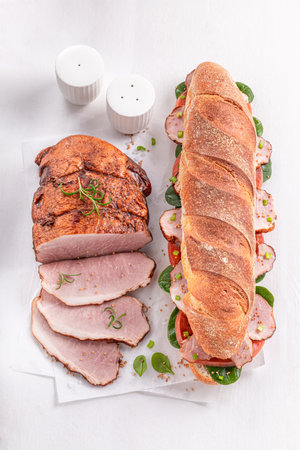 Homemade and tasty sandwich for morning breakfast. Sandwich with vegetables and ham.の写真素材