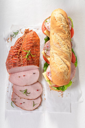 Tasty and fresh sandwich with ham, tomato and lettuce. Sandwich with vegetables and ham.の写真素材