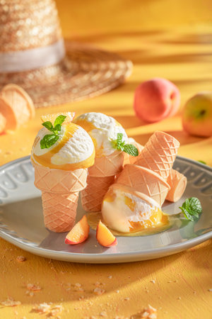 Homemade and tasty peach ice cream as a creamy dessert. Ice cream made of cream and peaches.