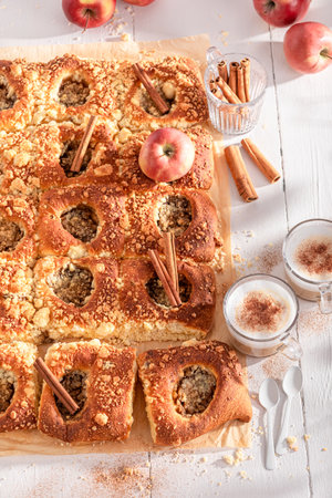 Delicious apple yeast cake served with milk. Yeast cake with cinnamon and crumble.の写真素材