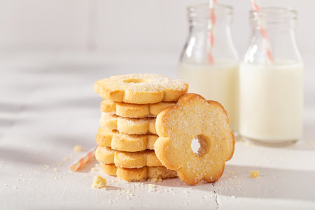 Crunchy and tasty butter cookies baked in a home bakery. Butter cookies served with milk.の写真素材