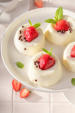 Tasty and homemade monoportion cheesecake with strawberries and glazed. Strawberry cheesecake with vanilla glazed.の写真素材
