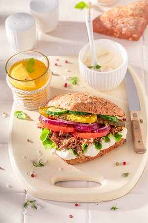 Fresh and delicious sandwich made of vegetables and beef. Sandwich with vegetables and pulled beef.の写真素材