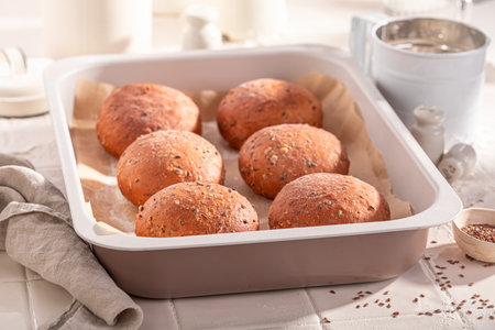 Homemade and healthy flax seed rolls baked in the bakery. Flax seed rolls and ingredients in the bakery.の写真素材