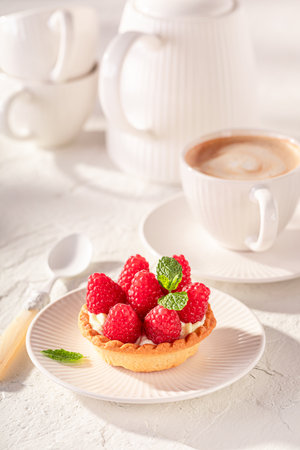 Tasty and homemade mini tart made of cream and raspberries. Cake with raspberries and cream.の写真素材