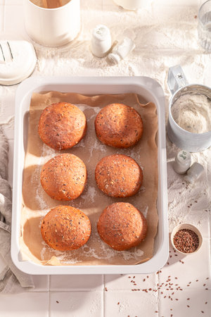 Homemade and healthy flax seed rolls made of sourdough. Flax seed rolls and ingredients in the bakery.の写真素材