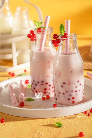 Fresh and chilled red currant bubble tea full of vitamins. Summer milky drink.の写真素材
