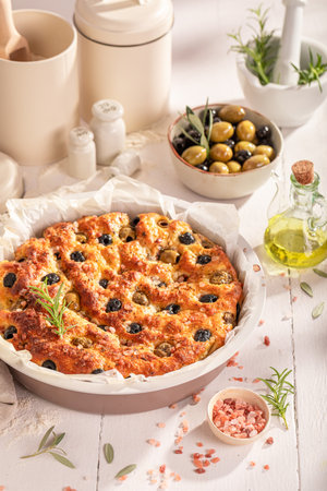 Traditional focaccia baked in round baking tin. Poster for Restaurant. Focaccia made of simple ingredients.の写真素材