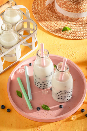 Sweet blueberry bubble tea with milkshake, balls and ice. Summer milky drink.の写真素材
