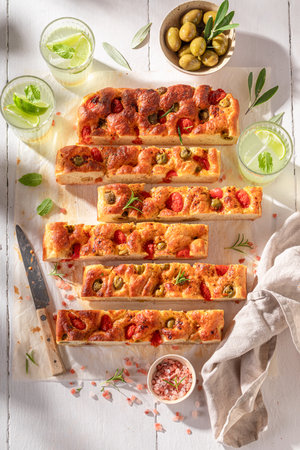 Homemade and tasty focaccia served with cold lemonade. Traditional Italian Focaccia.の写真素材