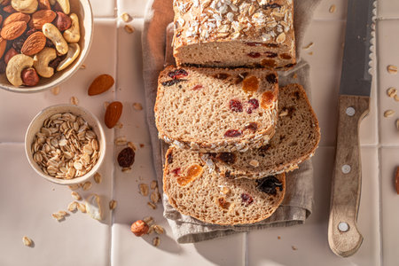 Homemade delicacies bread as source of energy and fiber. Bread with nuts, raisins and bran.