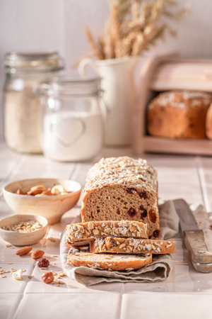Healthy delicacies bread with nuts, raisins and dried fruits. Bread with nuts, raisins and bran.の写真素材